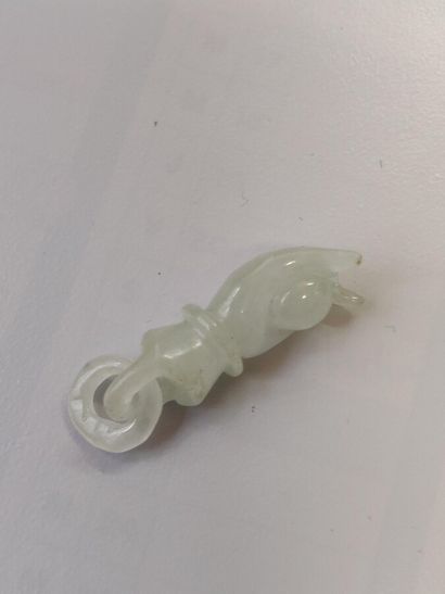 null 102. Jadeite pendant in the shape of a guanyn hand.