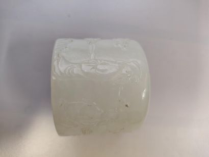 null 104. Ring of archer in white jadeite with decoration of

characters in a la...