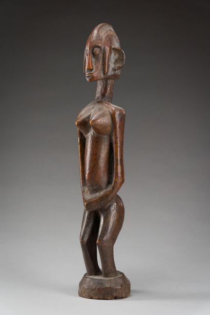 null 50. Female statue on circular pedestal, her hands joined on her

joined on the...