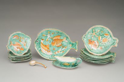 null Earthenware fish dinner service with polychrome decoration of fish among seaweeds.

It...