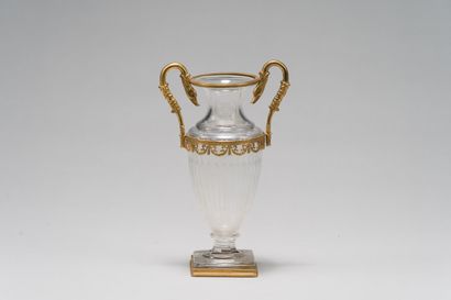 null Baluster vase in faceted crystal with engraved decoration of quivers and laurel...
