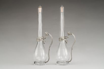 null Pair of decanters out of blown glass, the pewter mounting with decoration of...