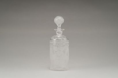 null Cylindrical bottle and its stopper out of faceted and engraved glass with decoration...