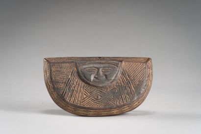 null AFRICA

Wooden box with incised decoration of character, arms crossed.

L :...