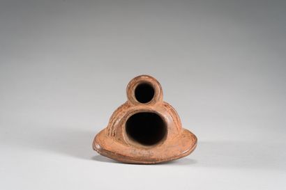 null AFRICA

Pipe in patinated terra cotta decorated with a face and a headdress.

H:...