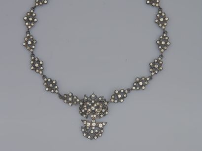 null 27. Lot of 3 silver jewelry set with rhinestones including :
a pendant decorated...