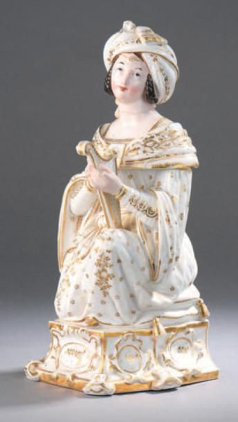 PARIS Tisanière en porcelaine à décor polychrome et or, en forme de harpiste.
Époque...