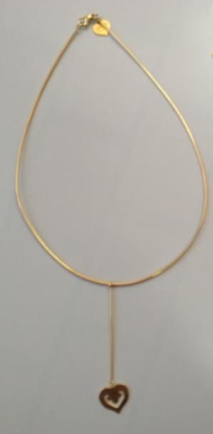 OJ PERRIN 
Coeur en or jaune 18K (750°/00) composé d'une chaîne maille oméga et d'un...