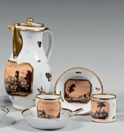VALOGNES Théière et deux tasses litron décorées dans des médaillons à pans coupés...