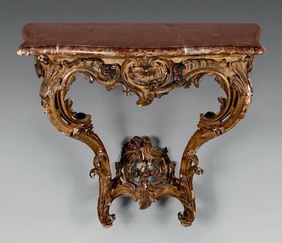 null Gilded wooden wall console with openwork belt of foliage and garlands. Two arched...