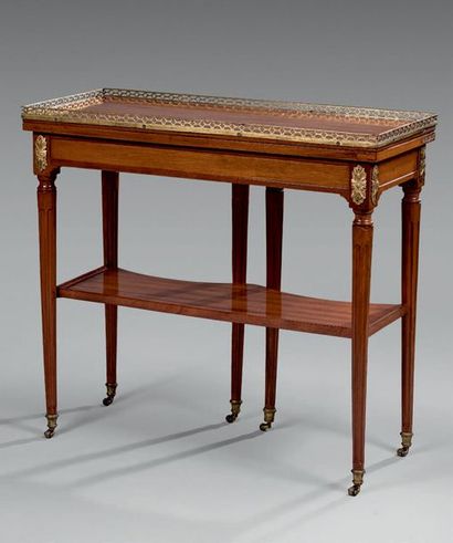 null Mahogany "changer" table with a folding top decorated with an openwork bronze...