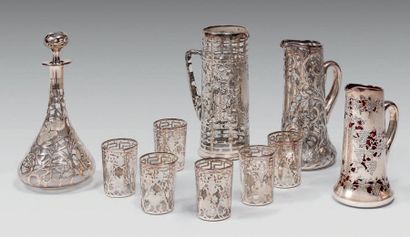 null Set of orangeade glasses in a silver fishnet decorated with flowers and scrolls...