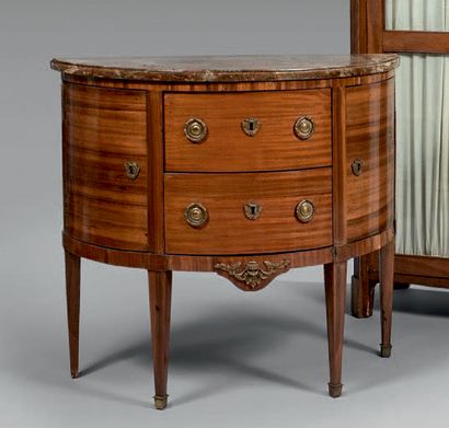 null Mahogany veneered half-moon chest of drawers opening with two drawers without...