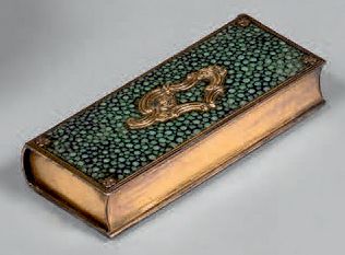 null Simulated book-shaped case in gilded brass decorated with stingray including...