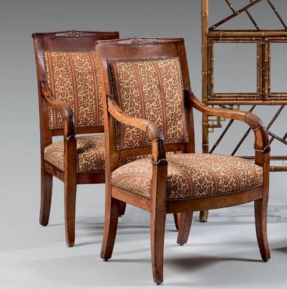 null Pair of mahogany armchairs with pedimented backrest. Armrests in horn of plenty....