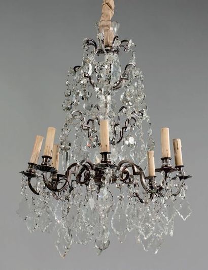 null Chandelier with eight silver bronze light arms decorated with crystal pendants...