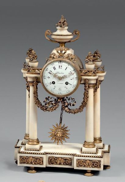 null Portico clock with four white marble columns decorated with gilded bronze garlands....