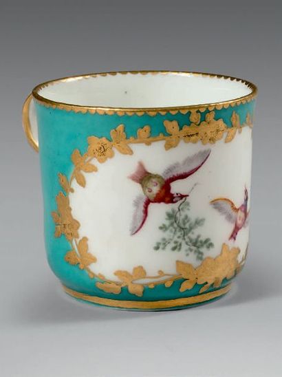 SÈVRES Small cup with a handle, polychrome decoration of two birds in flight in a...