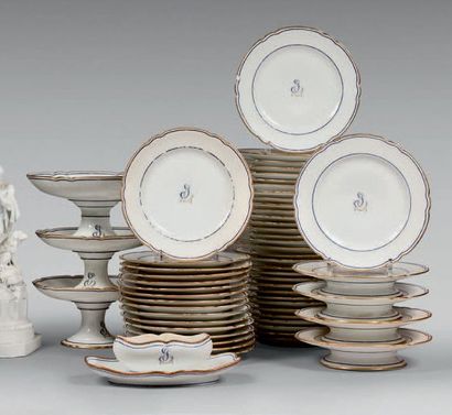 null White porcelain dessert service with blue fillets and golden wolf's teeth, monogrammed...