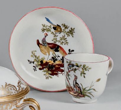 MENNECY Cup and saucer with polychrome decoration of birds on a mound. Marked.
18th...