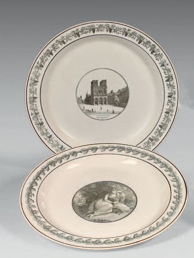 CREIL Two large round dishes decorated in grey monochrome with a view of Notre-Dame...