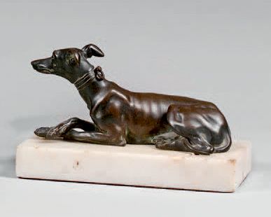 null White marble paper plaque decorated with a bronze coated greyhound with a medal...