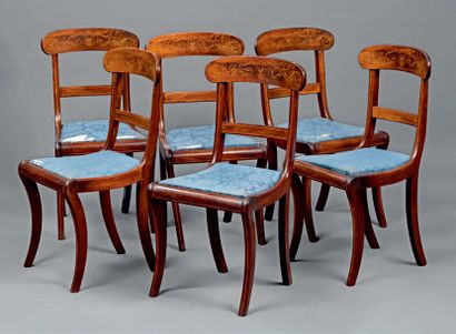 null A suite of six chairs with a mahogany frame with a moire backrest inlaid with...