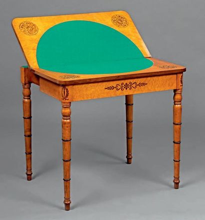 null Game table with a folding top in speckled maple veneer inlaid with rosewood...