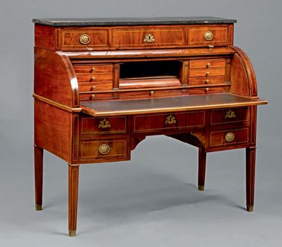 null Mahogany and brass filet cylinder desk opening with three drawers in tiers,...