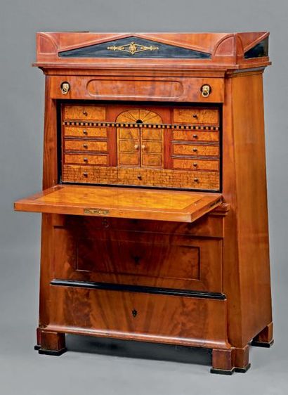 null Trapezoid-shaped mahogany secretary opening to a drawer, a flap revealing an...
