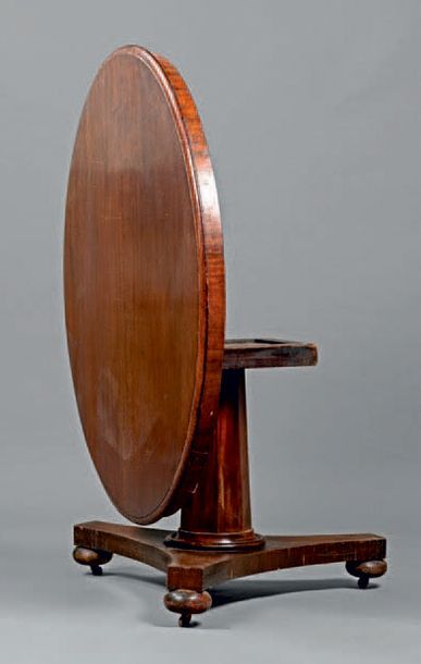 null Large mahogany pedestal table with tilting tray. Panelled barrel on a star base...