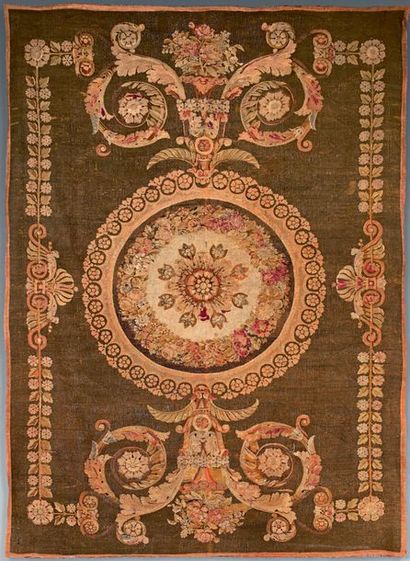 null Aubusson carpet with central rosette and leafy scrolls on an almond background.
Leafy...
