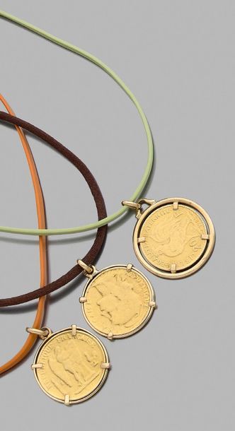 null Three green, orange and brown leather necklaces each bearing a twenty franc...