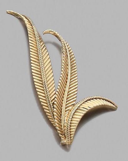 null Brooch "fern" in yellow gold 750 thousandths engraved.
Height: 7.5 cm
Weight:...