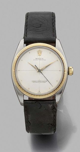 ROLEX Ref. 1008, n°666451
Steel and gold bracelet watch. Round case, gold bezel,...