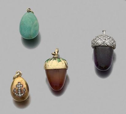 null Set of four egg and acorn pendants in various hard stones mounted in 750 thousandths...