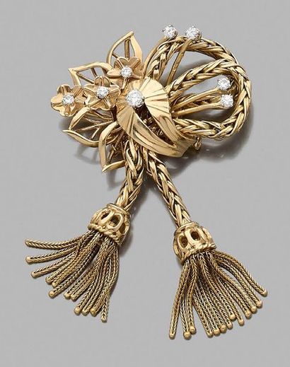 null Broche noeud à décor de fleur en or jaune 750 millièmes partiellement sertie...