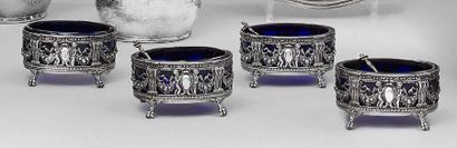null A series of four oval salerons in 950-thousandths openwork silver decorated...