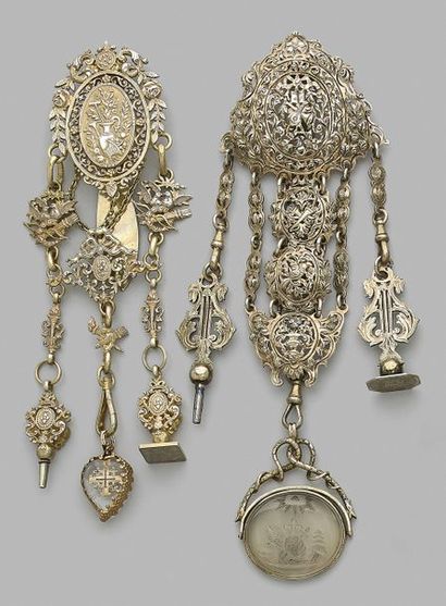 null Set of two openwork vermeil castelaines decorated with trophies and floral scrolls...