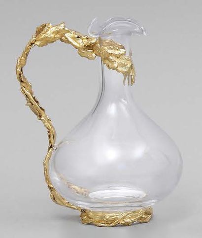 null Carafe en verre, la monture en bronze doré à décor de feuilles de chêne.
Hauteur:...