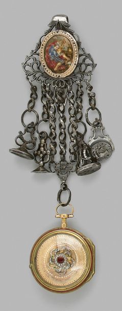 null Openworked metal chain decorated with a polychrome enamelled medallion depicting...