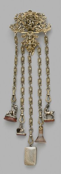 null Gilt vermeil chatelaine decorated with mascaron, putti, lion mittens and five-stranded...