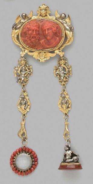 null Oval silver and vermeil brooch decorated with a coral cameo depicting two heads...
