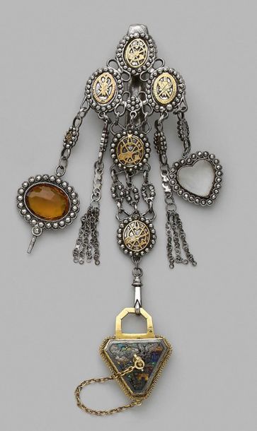 null Chatelaine in metal and gilded metal with oval medallions decorated with attributes...