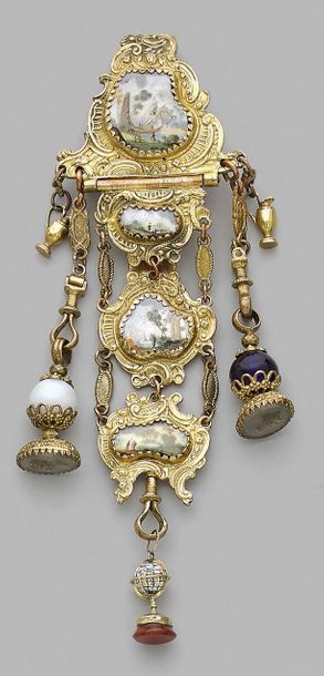 null Gilded metal castelaine with rocaille decoration of staples decorated with four...