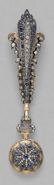 null A gold and silver chatelaine with a stylised fleur-de-lys decoration entirely...
