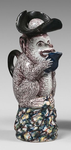 DELFT Pitcher in the shape of a monkey sitting on a base with a base of abstract...