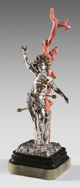 Statuette in silver repoussé and carved representing...
