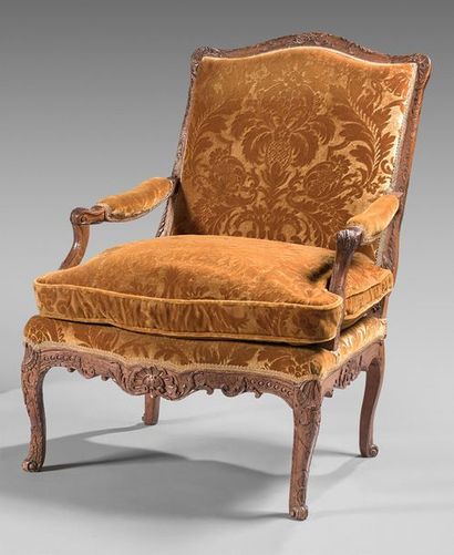null Armchair with flat back in ash and beech carved with foliage and shells. Armrests...