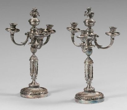 null Pair of three-light silver plated metal torches richly decorated with ribbons,...